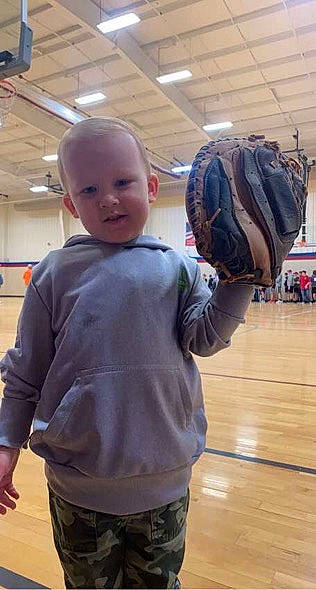 Rayden is registered to the contest to win money with this photo: baby, bag, ball, baseball_glove, child, flooring, fun, glove, hardwood, joint, luggage_and_bags, person, room, sleeve, sports_equipment, sports_gear, sportswear, standing, t_shirt, toddler