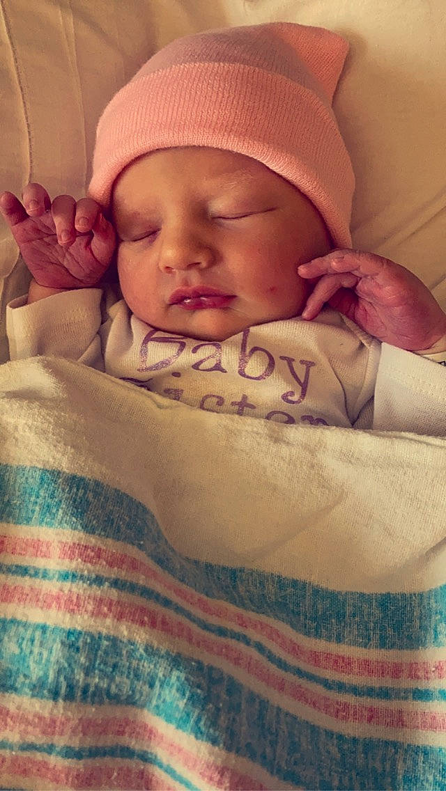 Jovi is registered to the contest to win money with this photo: baby, baby_sleeping, baby_toddler_clothing, cap, cheek, child, comfort, face, facial_expression, finger, gesture, headwear, linens, lip, mouth, nose, person, skin, sleeve, textile