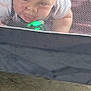 Waylon joined the competition — help win amazing prizes! baby, child, face, mesh, netting, toy, green_light, curious, indoor, carpet, white_clothing, blond_hair, closeup, peek, playpen, infant, crawling, person, baby_toy, mesh_screen