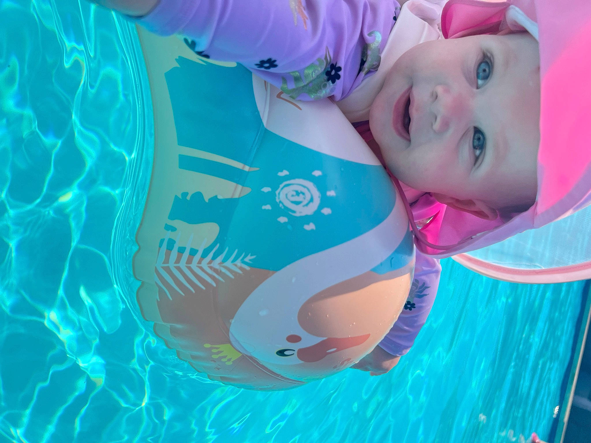 Arrow is registered to the contest to win money with this photo: aqua, azure, baby, child, electric_blue, eyelash, fictional_character, fun, happy, headwear, leisure, magenta, pattern, person, portrait_photography, recreation, smile, toddler, water