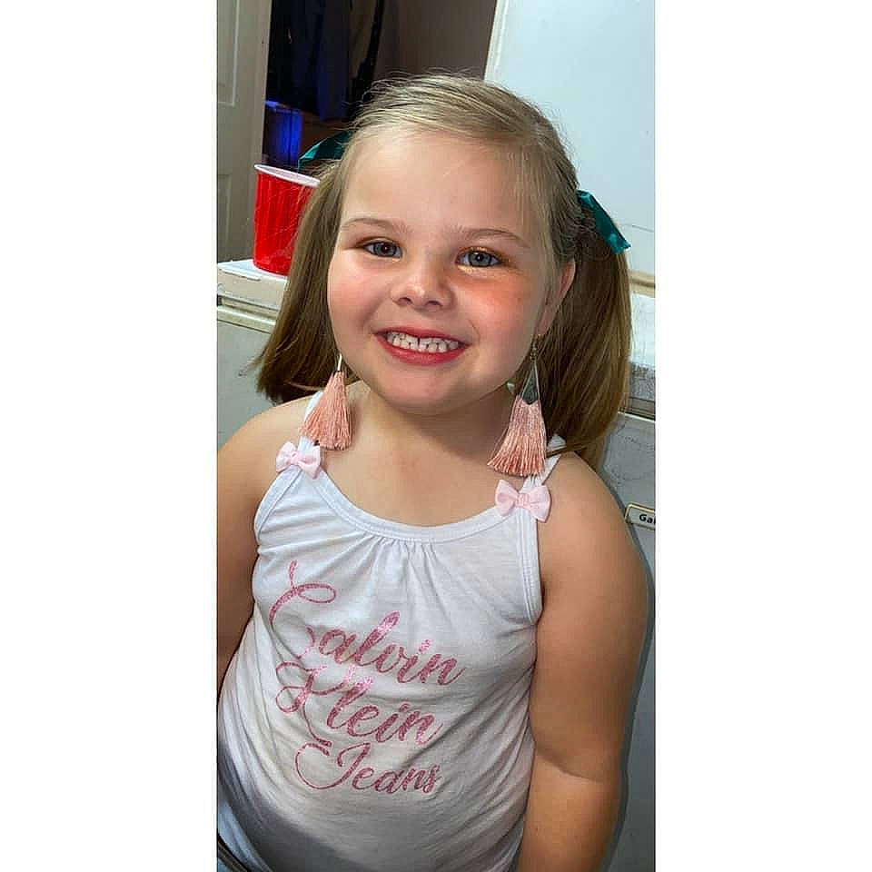 Lilyanna is registered to the contest to win money with this photo: arm, blond, cheek, child, child_model, ear, eyebrow, face, facial_expression, hair, hairstyle, happy, head, joy, people, person, shoulder, skin, smile, t_shirt
