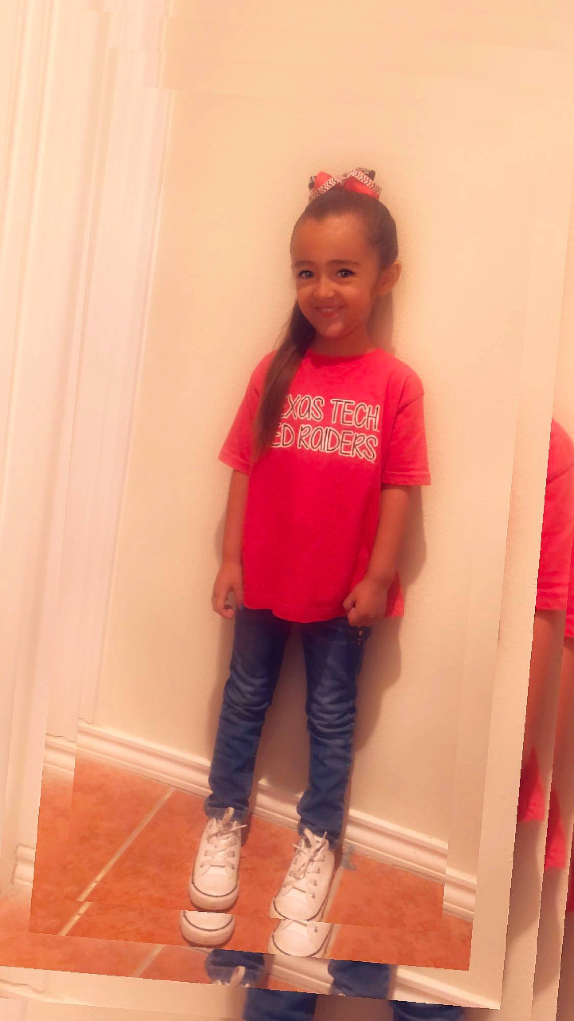 Zaylie is registered to the contest to win money with this photo: child, child_model, clothing, denim, footwear, jeans, joint, joy, magenta, outerwear, peach, person, pink, red, shoe, shoulder, skin, sleeve, standing, t_shirt