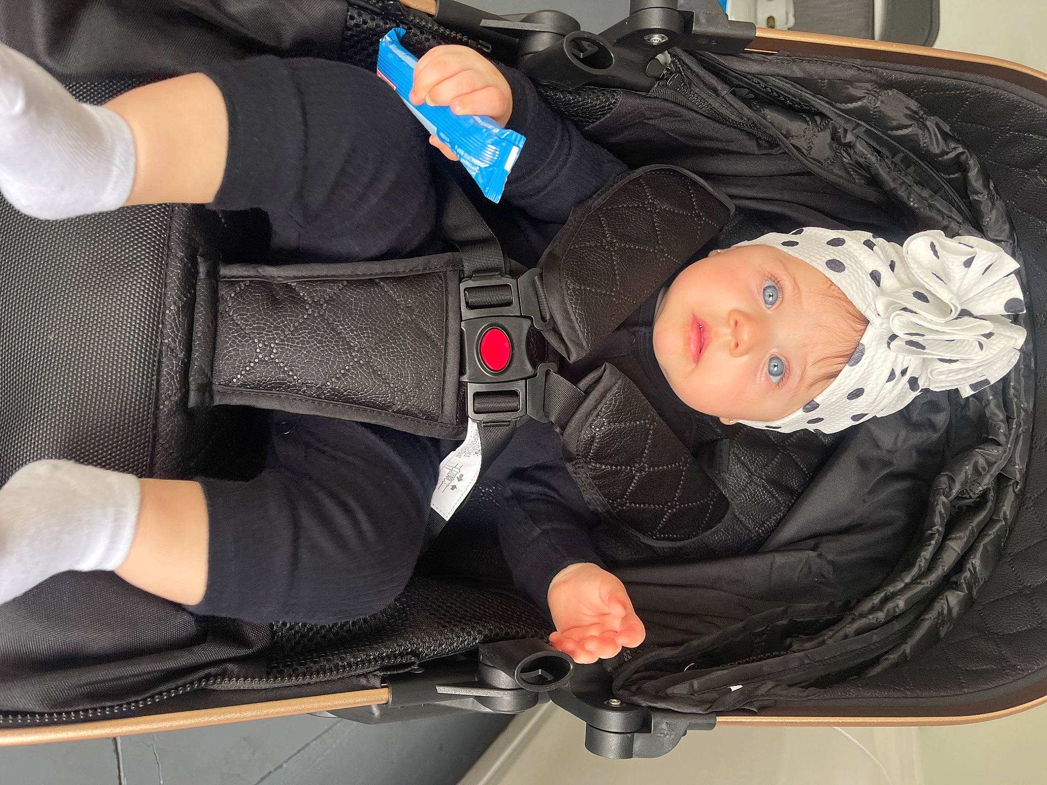 Zoey joined the competition — help win amazing prizes! auto_part, baby, baby_carriage, baby_products, bag, car_seat, clothing, comfort, elbow, hat, headwear, human_leg, knee, lap, person, sitting, sleeve, sportswear, textile, thigh
