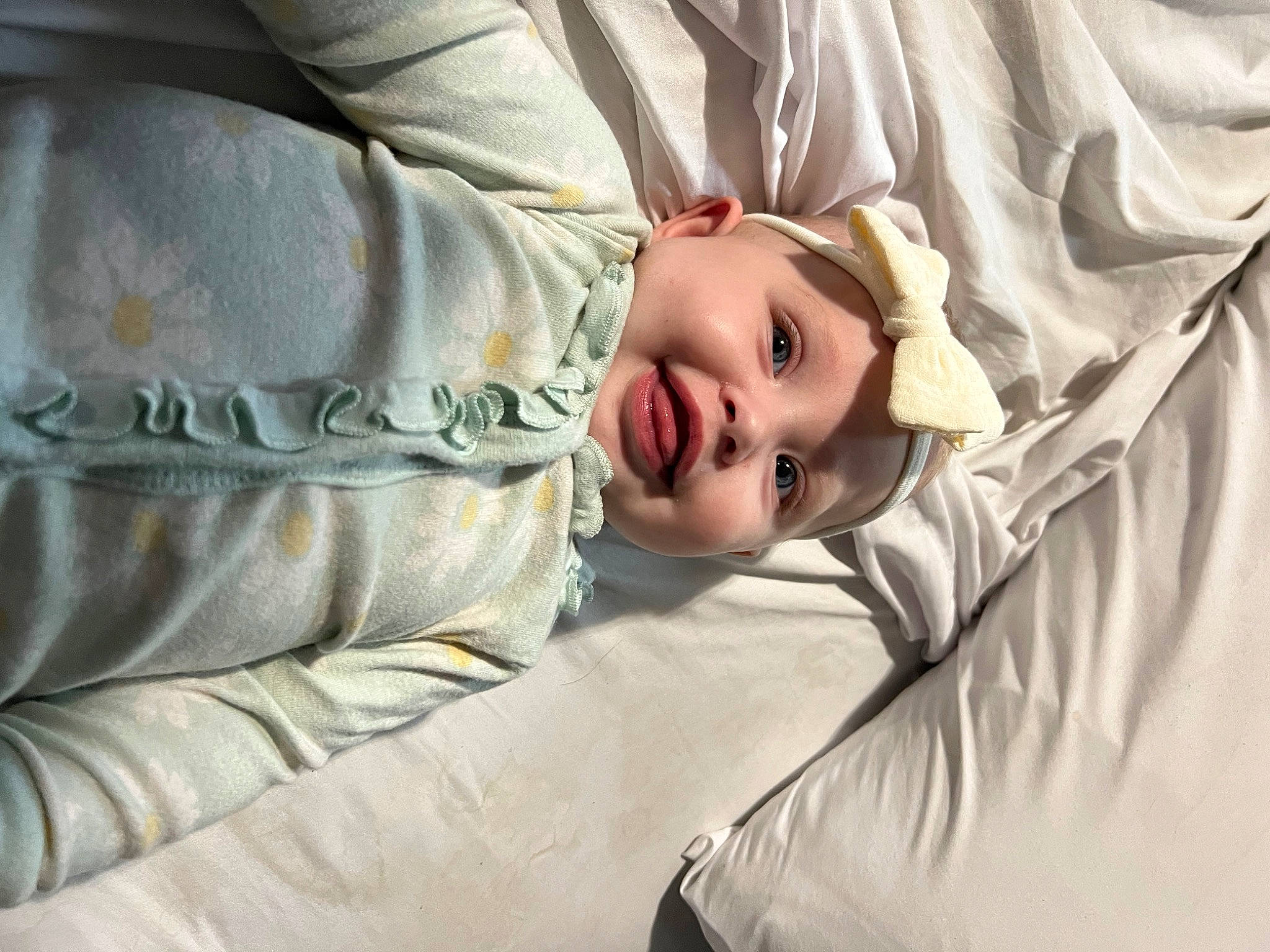 Ava is registered to the contest to win money with this photo: baby, bedding, bedtime, blanket, child, comfort, couch, eye, eyelash, fur, head, headwear, linens, person, room, sitting, sleep, sleeve, textile, toddler