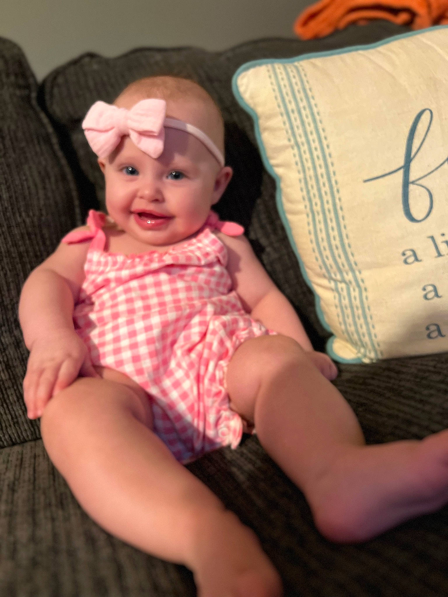 Ava is registered to the contest to win money with this photo: baby, baby_toddler_clothing, beauty, child, comfort, finger, hat, human_leg, joy, knee, lip, pattern, person, plaid, sitting, skin, sleeve, smile, tartan, textile