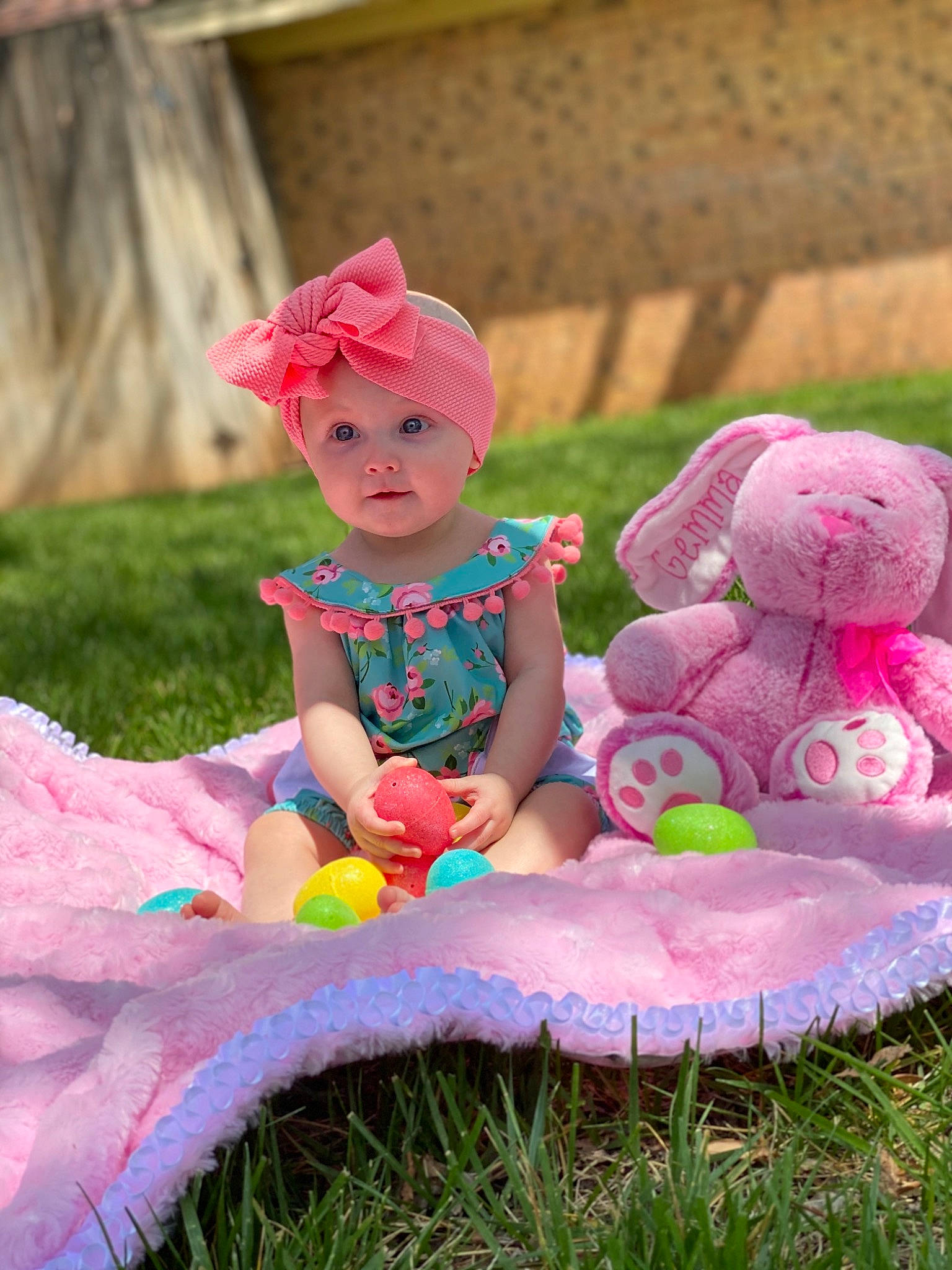 Gemma is registered to the contest to win money with this photo: baby, baby_toddler_clothing, baby_toys, child, dress, fun, grass, headwear, magenta, person, photography, pink, plant, play, product, sitting, skin, stuffed_toy, toddler, toy