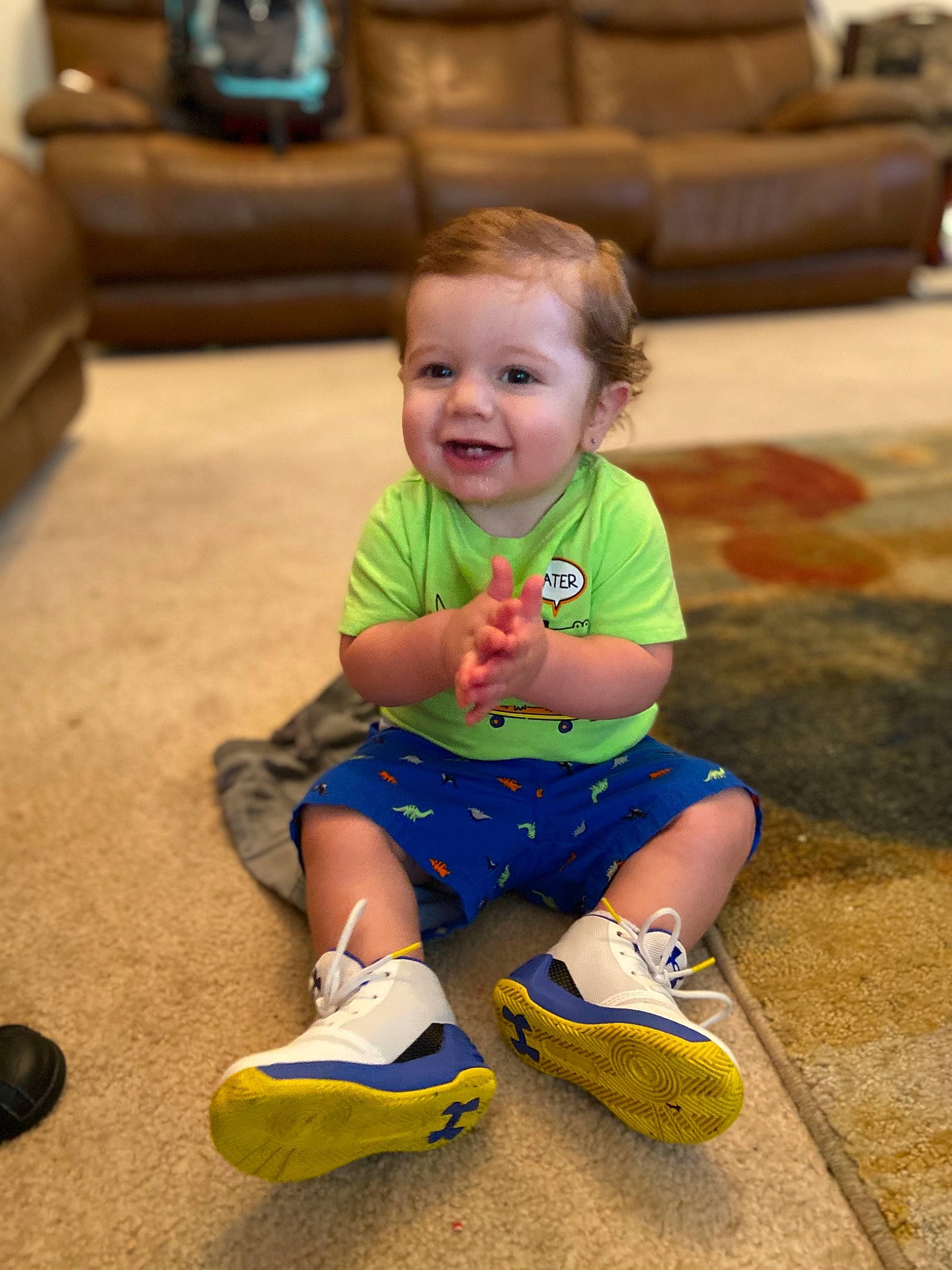 Ragnar is registered to the contest to win money with this photo: baby, child, floor, flooring, footwear, fun, green, joy, leg, leisure, person, play, shoe, sitting, skin, smile, toddler, vacation