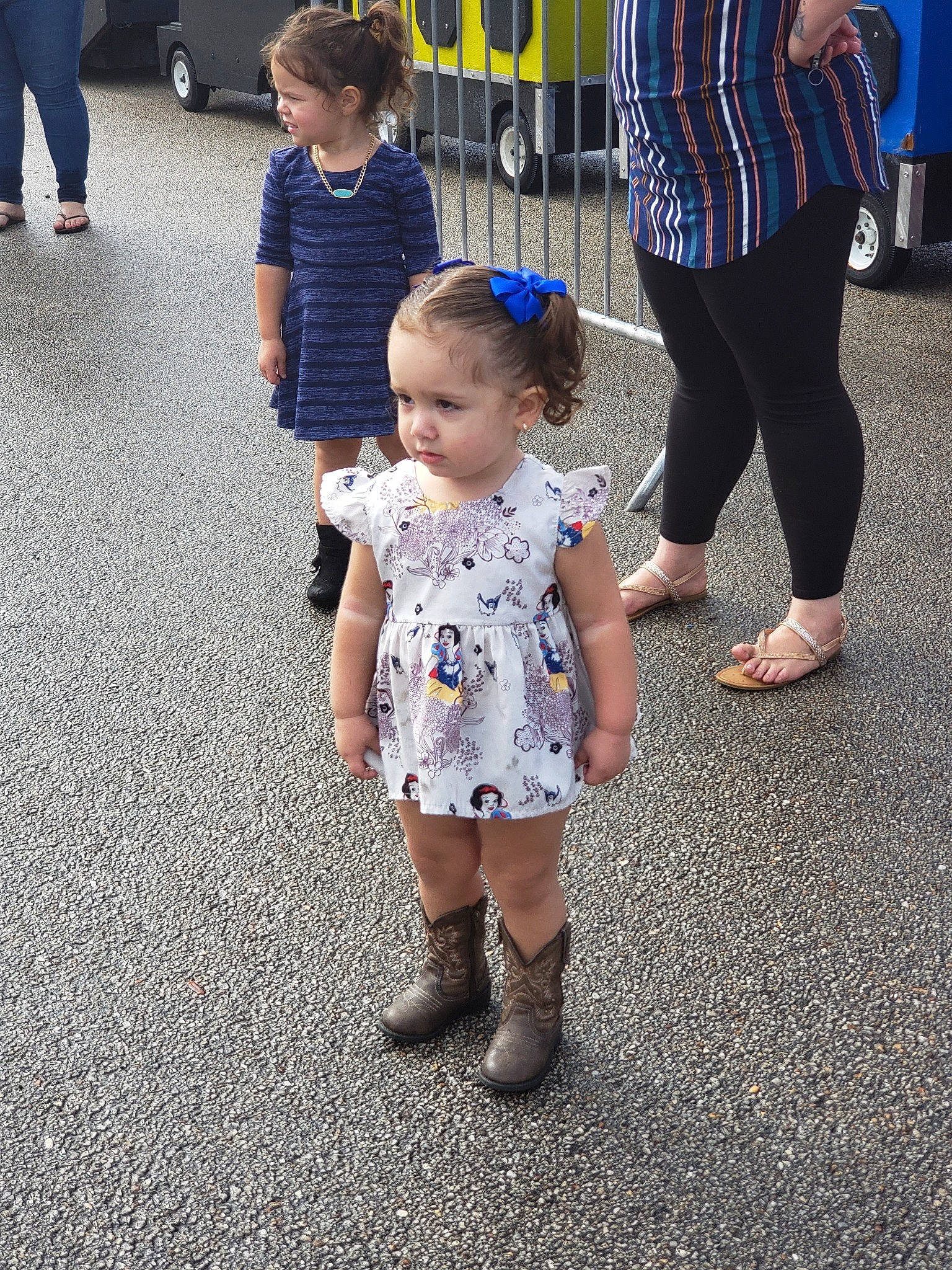 Skylar Grace is registered to the contest to win money with this photo: child, clothing, day, dress, footwear, fun, girl, leg, person, play, product, recreation, shoe, snapshot, standing, street, toddler