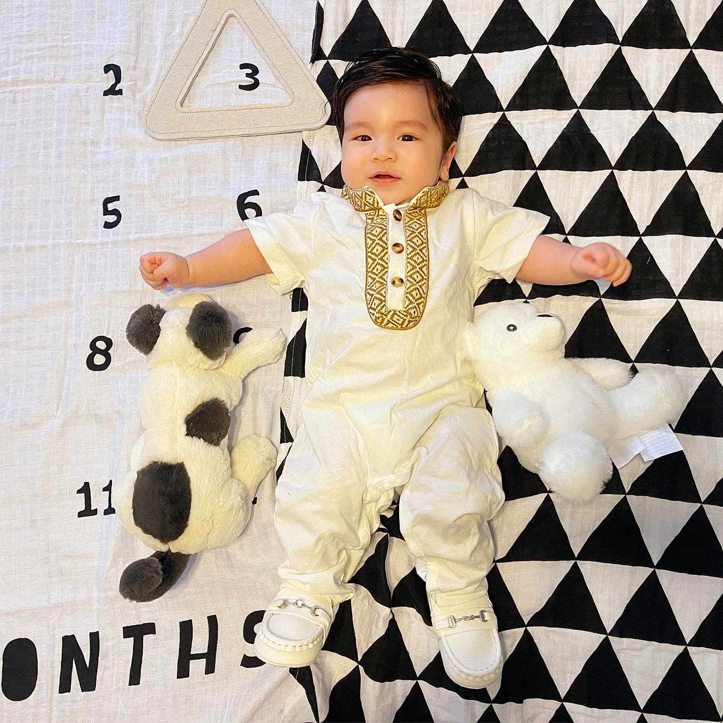 Harrison joined the competition — help win amazing prizes! accessories, baby, bodypart, clothing, dress, face, finger, formalwear, hand, head, homedecor, pants, person, photography, plush, portrait, sitting, teddybear, tie, toy