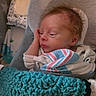 Elias joined the competition — help win amazing prizes! newborn, baby, infant, child, portrait, indoors, swaddled, blanket, crochet, turquoise, striped_blanket, sleeping, awake, face, hair, hand, crib, cushion, cozy, home