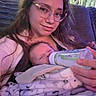Elias joined the competition — help win amazing prizes! baby, infant, caregiver, young_person, bottle, feeding, sleeping, cuddling, glasses, face, portrait, indoors, couch, blanket, clothing, 家庭, cozy, home, close_up, photography
