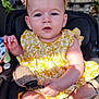 baby, blurred_background, cafe, car_seat, casual, child, curious_expression, cute, daylight, infant, outdoor, people, person, portrait, seatbelt, smile, summer_clothing, sunlight, toy, yellow_dress