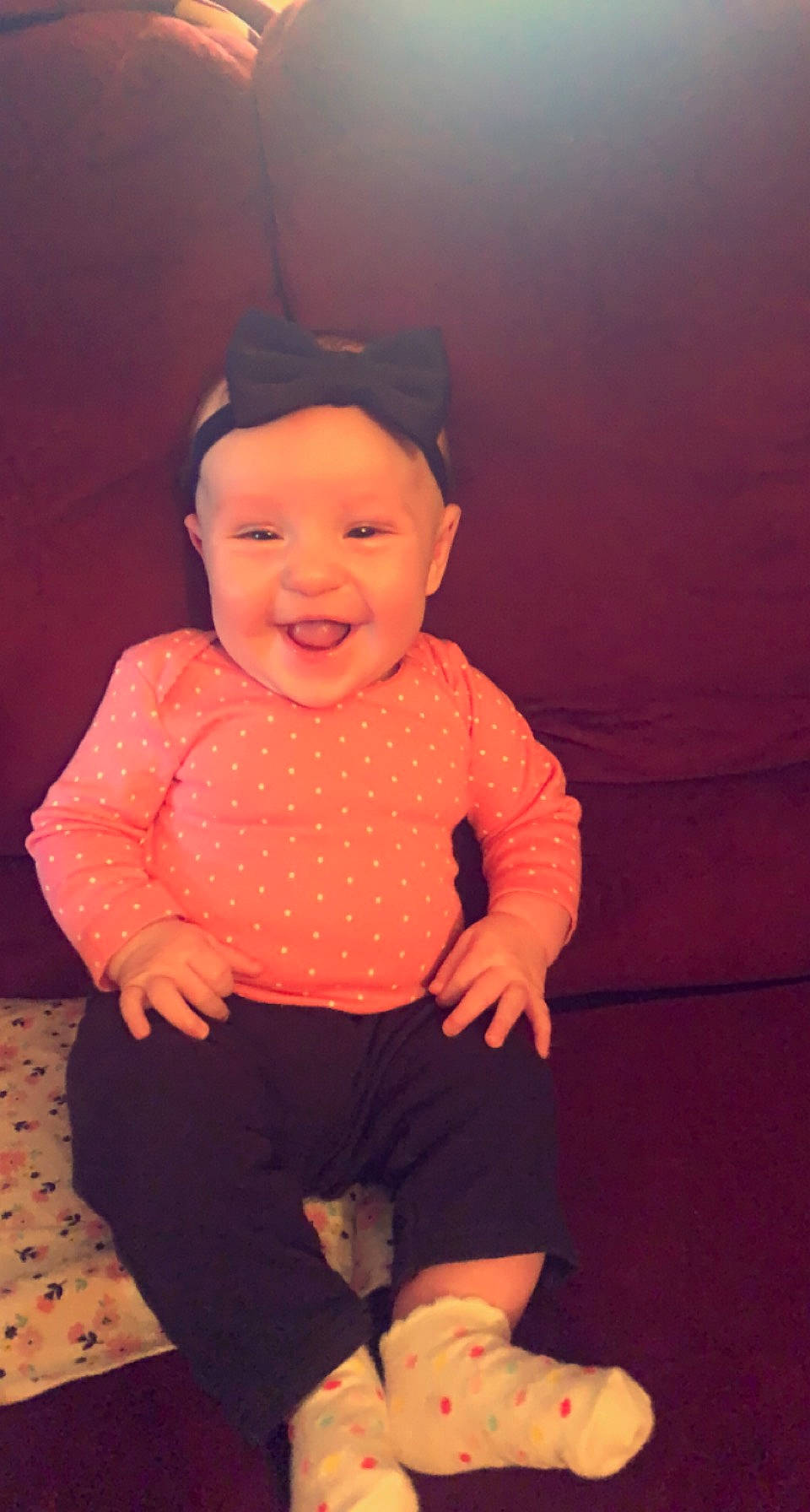 Makenzie is registered to the contest to win money with this photo: arm, baby_toddler_clothing, cheek, chin, cool, eye, face, finger, hairstyle, happy, head, headwear, human, human_body, joy, nose, orange, organ, person, pink