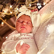 Maliah joined the competition — help win amazing prizes! baby, blanket, celebration, christmas, cozy, cute, face, festive, hand, headband, holiday, indoors, infant, lights, newborn, peaceful, portrait, sleeping, soft, warm