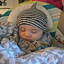 Charley joined the competition — help win amazing prizes! baby, sleeping, hat, blanket, face, child, indoor, cozy, cushion, pattern, striped, soft, peaceful, toddler, clothing, portrait, rest, headwear, nursery, infant