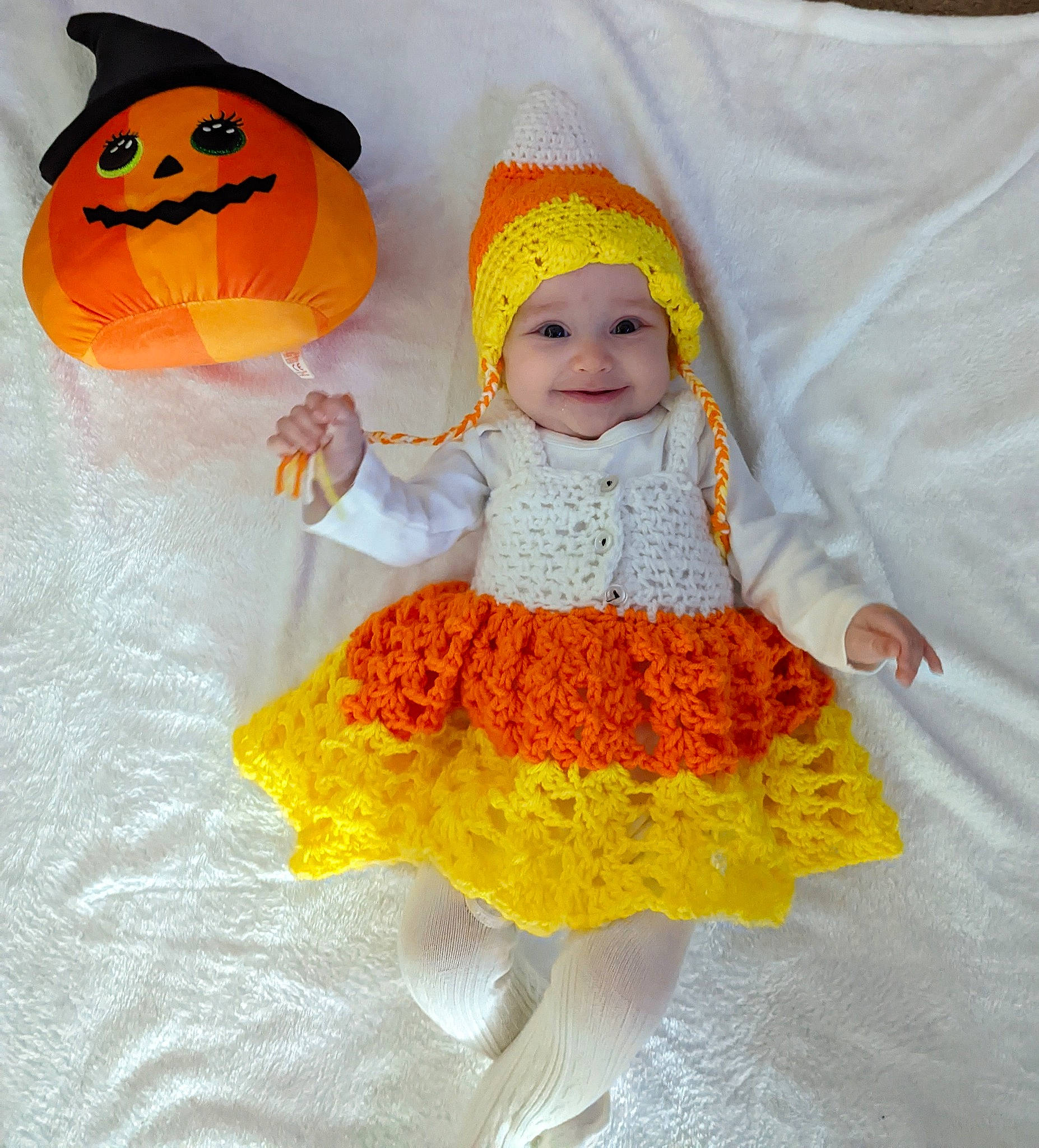 Amber joined the competition — help win amazing prizes! art, baby, baby_toddler_clothing, cap, costume_hat, creative_arts, happy, hat, headgear, headwear, joy, orange, pattern, peach, person, sleeve, smile, textile, thumb, toddler