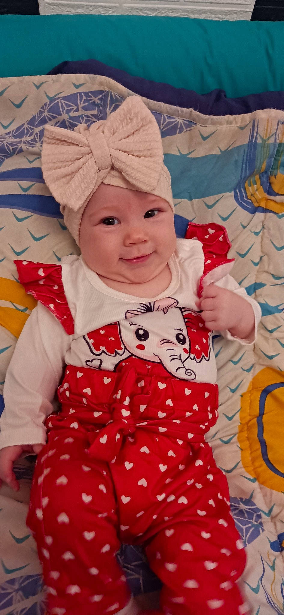 Hella participe au concours pour gagner de l'argent avec cette photo : art, baby, baby_toddler_clothing, beauty, child, clothing, dress, event, face, facial_expression, fun, happy, headwear, human_body, pattern, person, pink, product, sleeve, smile