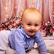 Aris participe au concours pour gagner de l'argent avec cette photo : baby, blanket, child, crawling, curtains, cute, face, flower_backdrop, happy, indoors, person, portrait, smiling, sock, soft_texture, striped_shirt, studio_photo, warm_lighting, white_pants, young_child