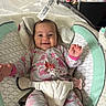 Gianna joined the competition — help win amazing prizes! baby, infant, smiling, onesie, dinosaur_pattern, baby_seat, toy, hand, face, comfort, cushion, indoor, playful, clothing, child, cute, happy, seatbelt, fabric, person