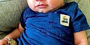 Ace joined the competition — help win amazing prizes! baby, beige_shorts, blue_shirt, child, clothing, cushion, cute, expression, face, gray_cushion, hair, hand, indoor, infant, looking, person, portrait, sitting, skin, young_child