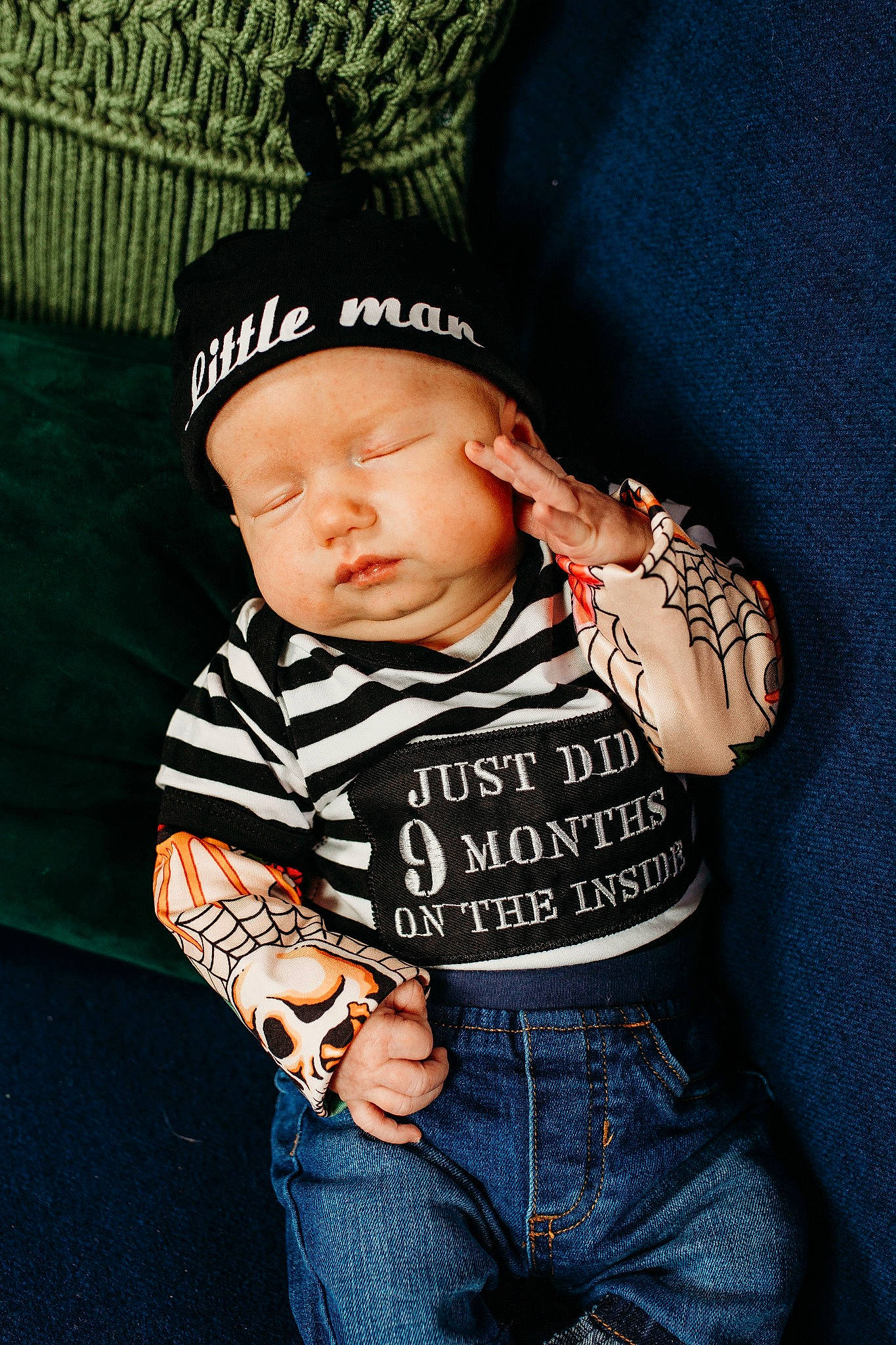 Lucian is registered to the contest to win money with this photo: arm, baby, baby_toddler_clothing, cap, child, cool, denim, elbow, eye, fashion_accessory, flash_photography, fun, hand, headwear, jeans, pattern, person, sitting, skin, sleeve