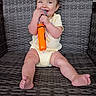 Isabel joined the competition — help win amazing prizes! baby, child, smiling, microphone, toy, sitting, woven_chair, cute, happy, infant, yellow_onesie, barefoot, indoor, portrait, playful, young_child, bright_colors, closeup, face, expression