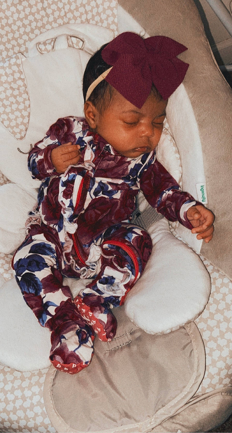 Nevaeh joined the competition — help win amazing prizes! baby, baby_products, baby_sleeping, baby_toddler_clothing, cap, carmine, child, comfort, face, fashion_accessory, flooring, fur, happy, linens, mammal, pattern, person, sitting, sleeve, toddler