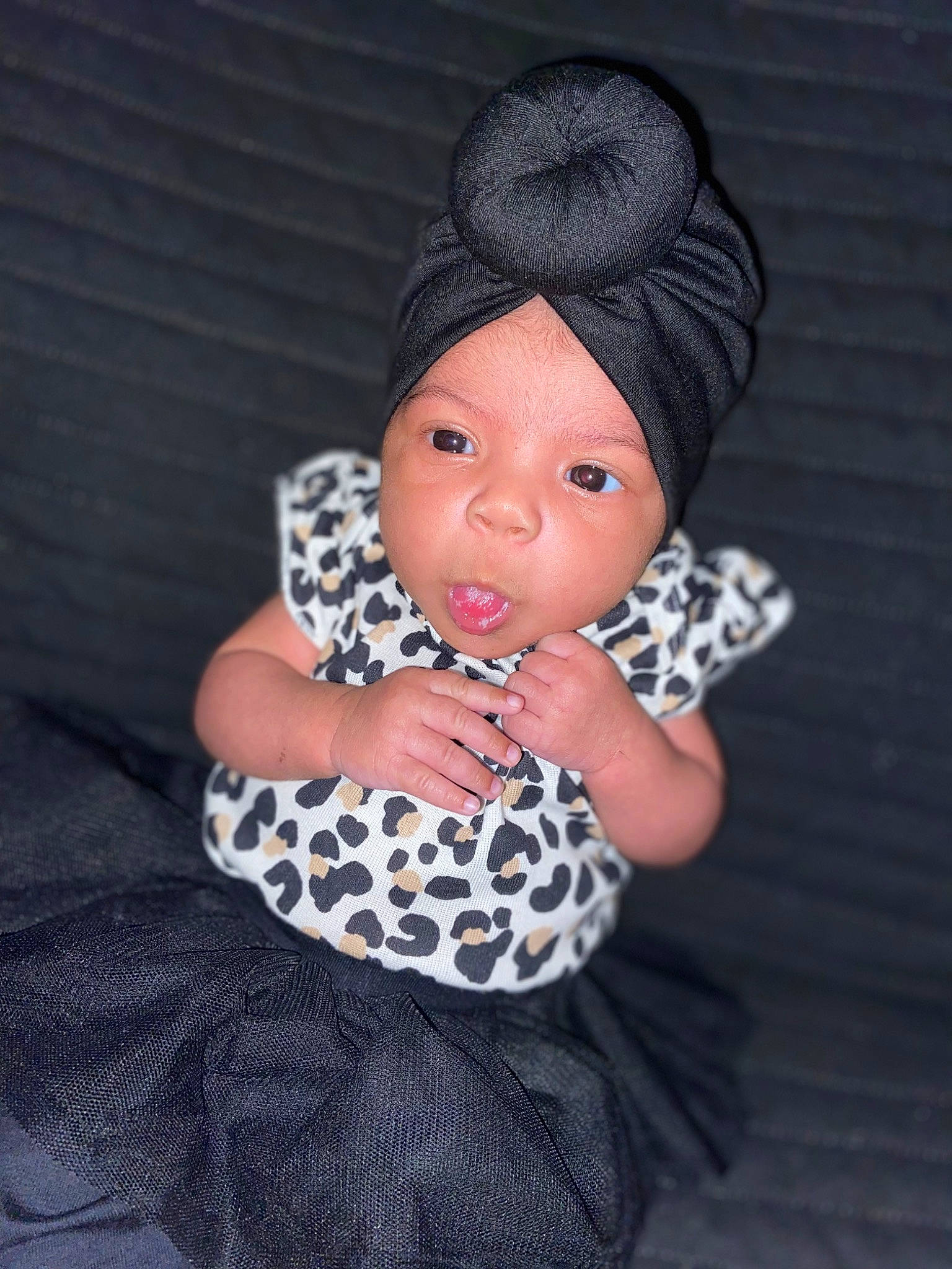 Nevaeh is registered to the contest to win money with this photo: baby_toddler_clothing, beanie, cap, child, creative_arts, doll, fashion_accessory, fashion_design, flash_photography, grey, head, headgear, headwear, knit_cap, one_piece_garment, pattern, person, sleeve, toddler, toy