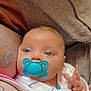 Malina is registered to the contest to win money with this photo: baby, pacifier, blue_eyes, blanket, tattoo, arm, couch, soft_texture, infant, closeup, skin, hand, comfort, resting, indoor, peaceful, person, newborn, cozy, portrait