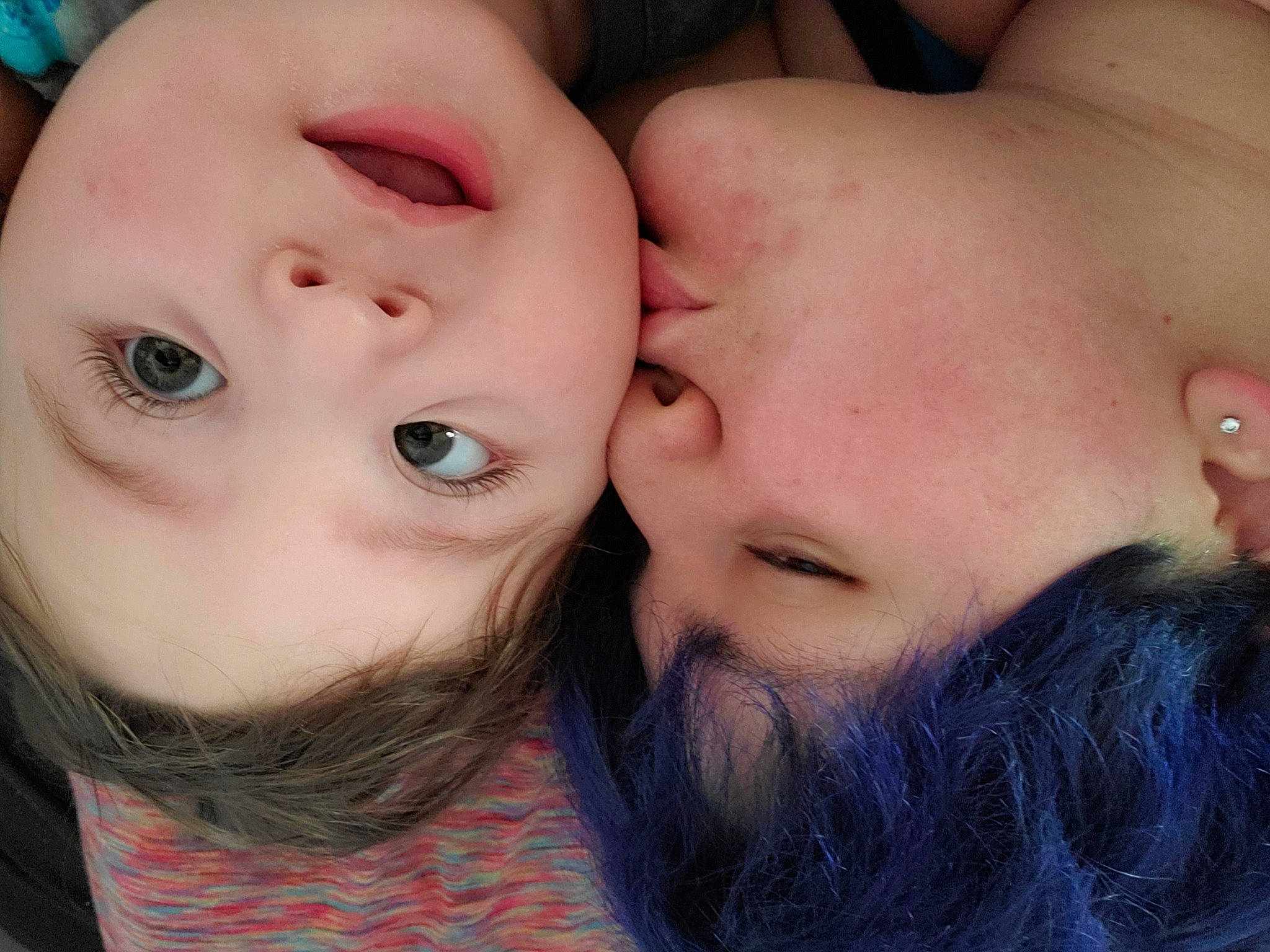 Karson is registered to the contest to win money with this photo: baby_toddler_clothing, cheek, cheek_kissing, chin, eyebrow, eyelash, facial_expression, flesh, forehead, interaction, iris, kiss, lip, love, neck, organ, person, romance, selfie, skin