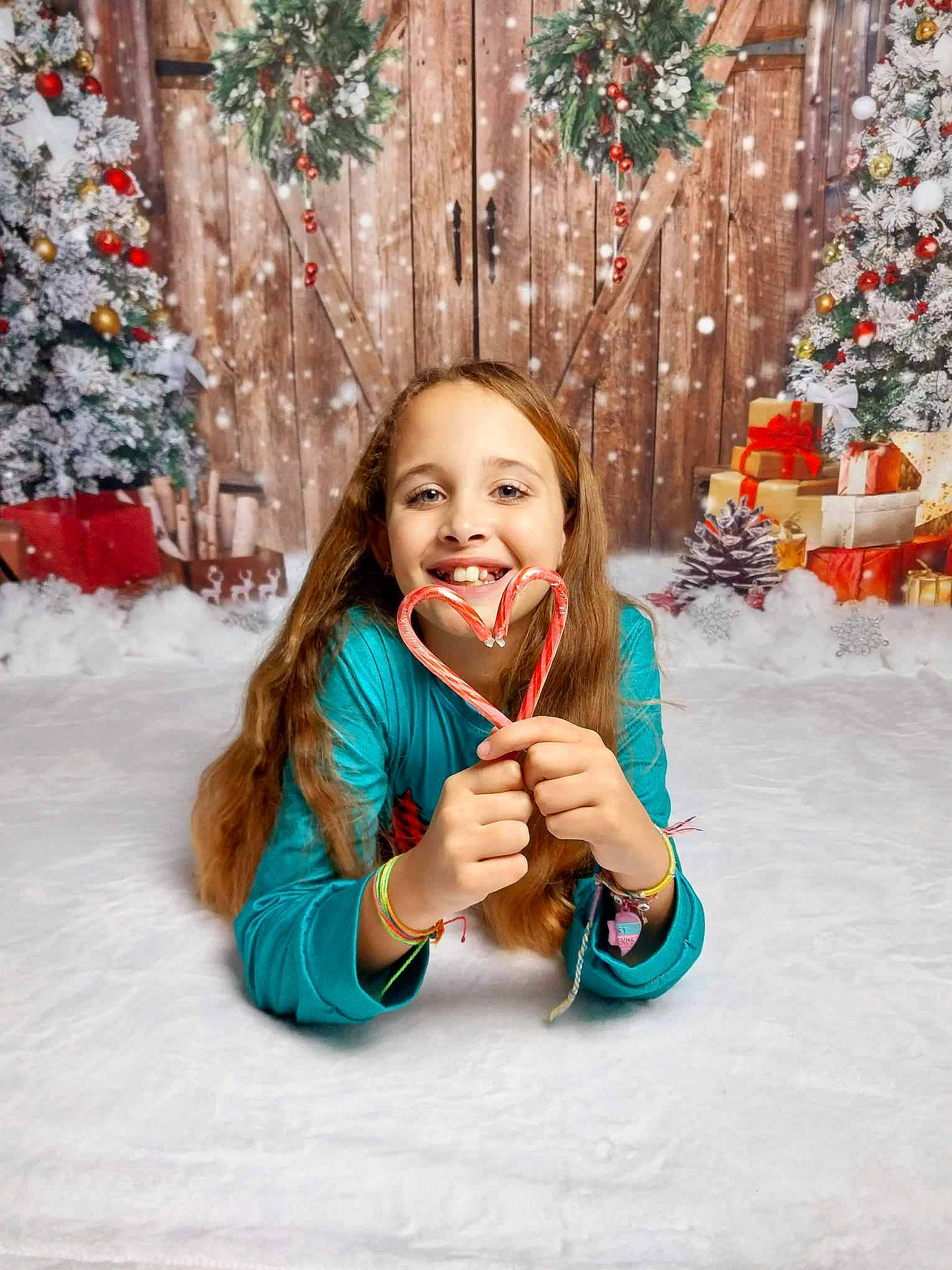 Makenzie is registered to the contest to win money with this photo: brown_hair, christmas, christmas_decoration, christmas_ornament, christmas_tree, clothing, event, freezing, fun, happy, holiday, holiday_ornament, jewellery, joy, ornament, outerwear, person, smile, snow, standing