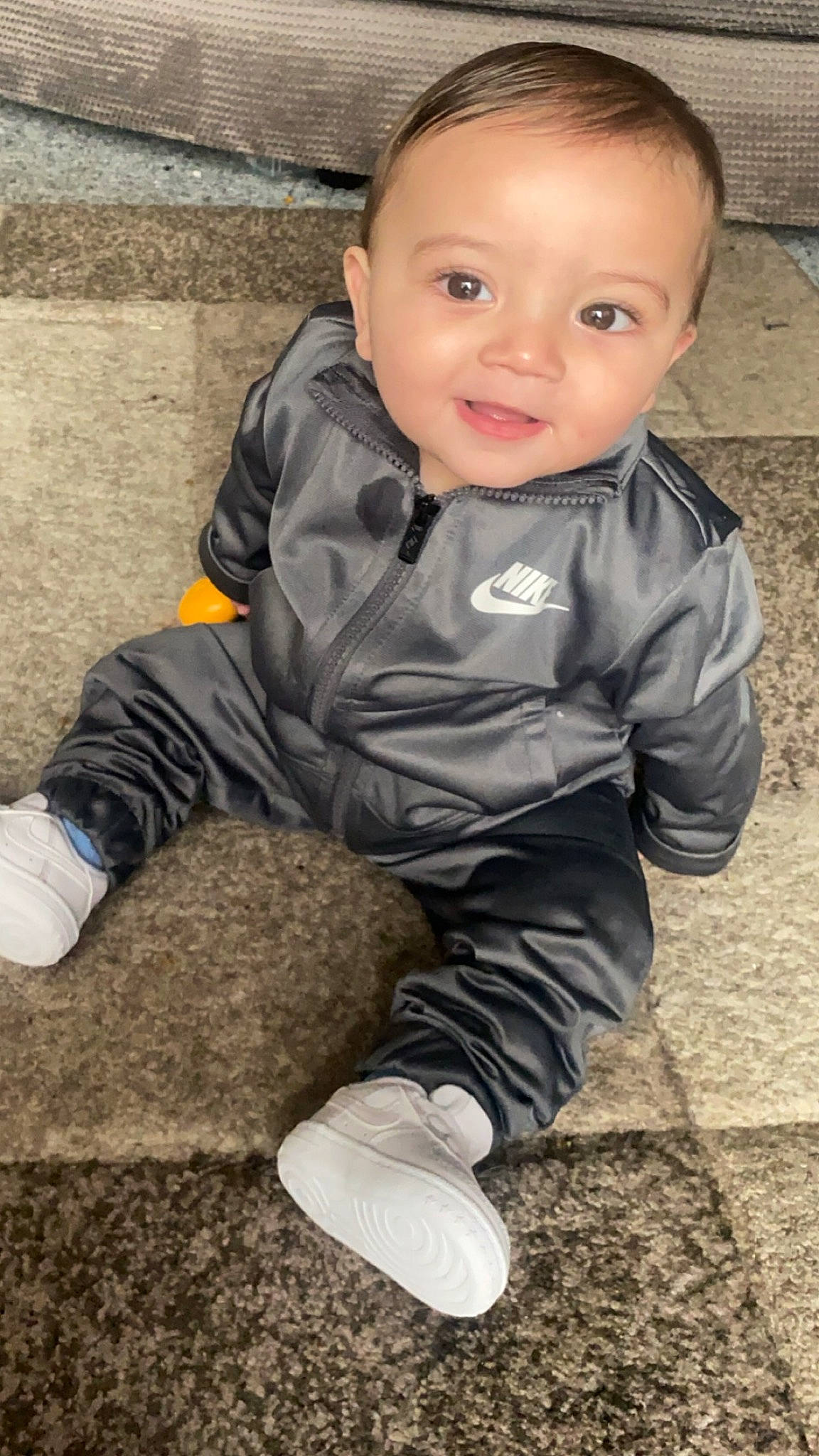 Amarni is registered to the contest to win money with this photo: baby, baby_toddler_clothing, cheek, child, eye, face, flash_photography, fun, grass, happy, head, person, portrait_photography, sitting, skin, sleeve, smile, soil, standing, toddler