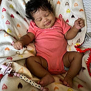 Nycelyn joined the competition — help win amazing prizes! baby, blanket, child, colorful, cute, happy, hearts, indoors, infant, onesie, pacifier, pacifier_clip, peaceful, person, portrait, relaxing, sleeping, smile, soft, toddler