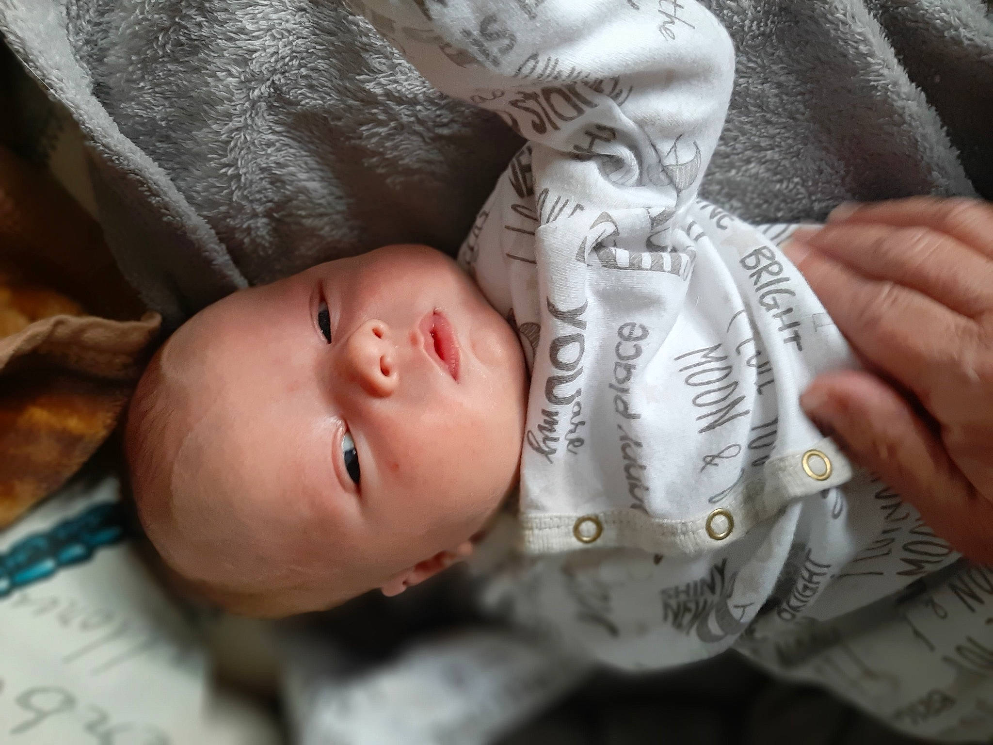 Callum joined the competition — help win amazing prizes! baby, baby_products, baby_toddler_clothing, cheek, child, comfort, eyelash, finger, gesture, hand, head, lip, mouth, nail, nose, pattern, person, skin, sleeve, textile