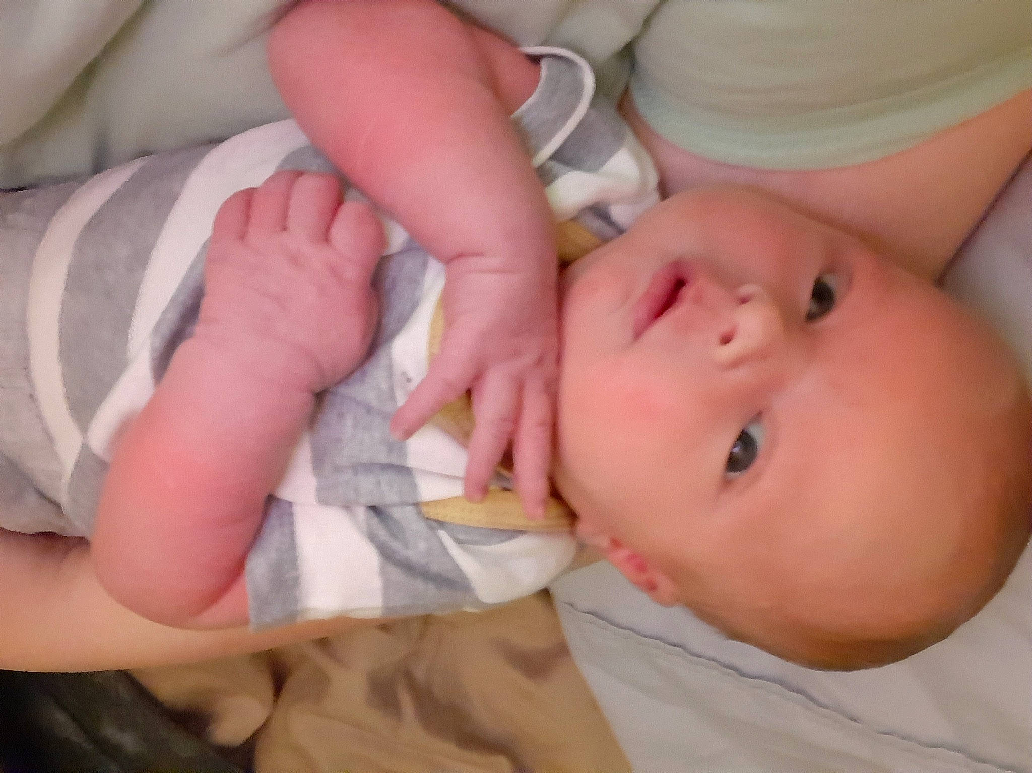 Callum is registered to the contest to win money with this photo: arm, baby, baby_toddler_clothing, cheek, child, comfort, eyelash, finger, gesture, hand, human_body, iris, lip, mouth, nail, nose, person, skin, thumb, toddler