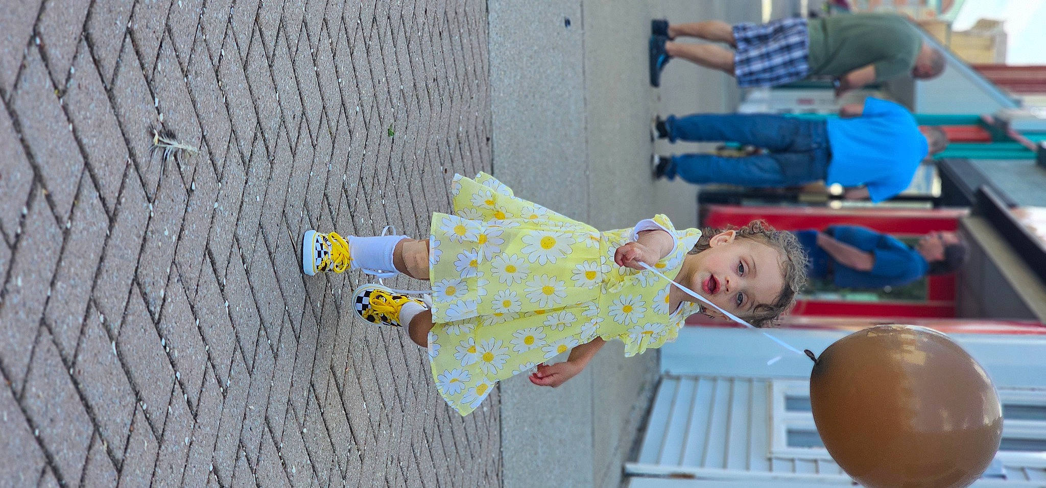 Iris is registered to the contest to win money with this photo: baby_products, baby_toddler_clothing, blurred, child, fun, happy, human_leg, leisure, magenta, pattern, person, plant, play, recreation, sandal, sitting, toddler, tree, vacation, wood