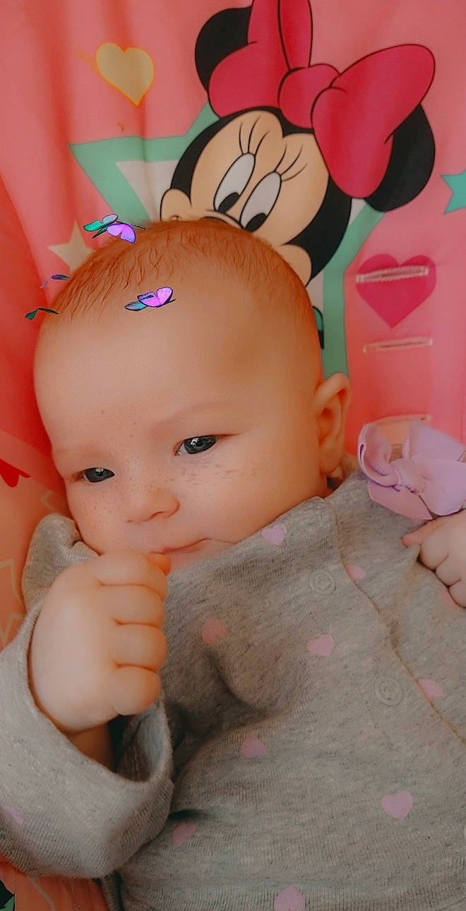 Montana is registered to the contest to win money with this photo: baby, baby_products, baby_toddler_clothing, baby_toys, cheek, doll, finger, nail, peach, person, pink, plush, skin, thumb, toy