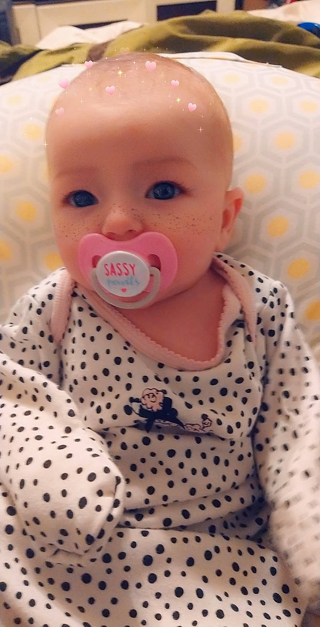 Montana is registered to the contest to win money with this photo: baby, baby_products, baby_toddler_clothing, cheek, child, eye, eyelash, linens, lip, nose, pattern, peach, person, pink, polka_dot, skin, toddler