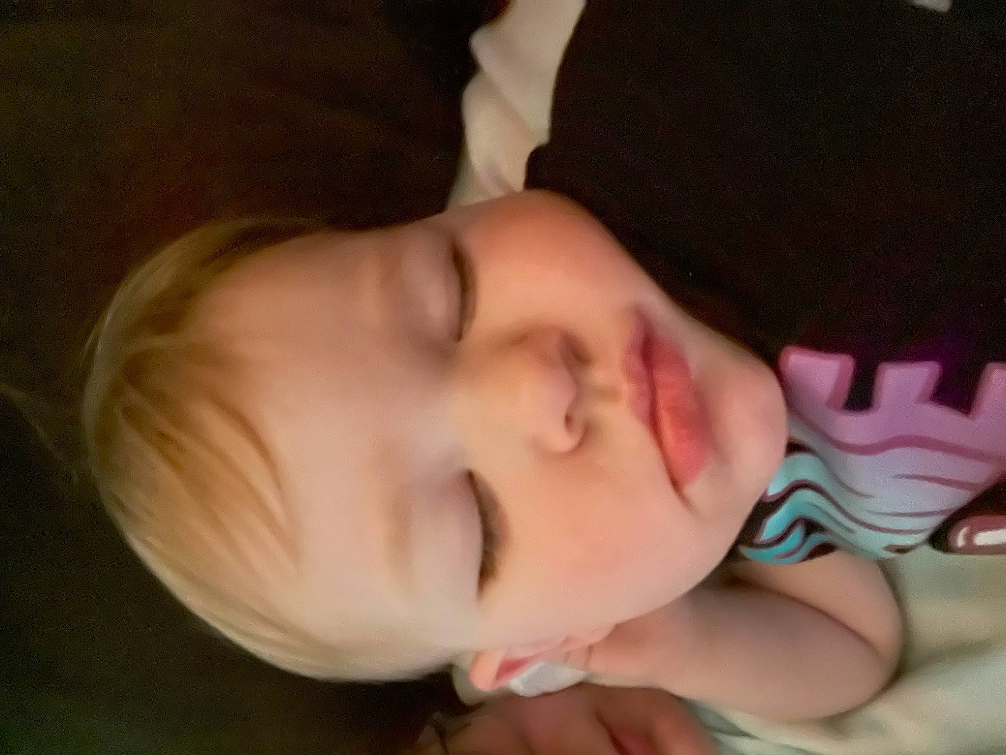 Montana is registered to the contest to win money with this photo: baby, baby_toddler_clothing, black_hair, cheek, comfort, ear, eye, eyelash, fashion_accessory, fun, hand, happy, headgear, human_body, iris, lip, nap, nose, person, plant