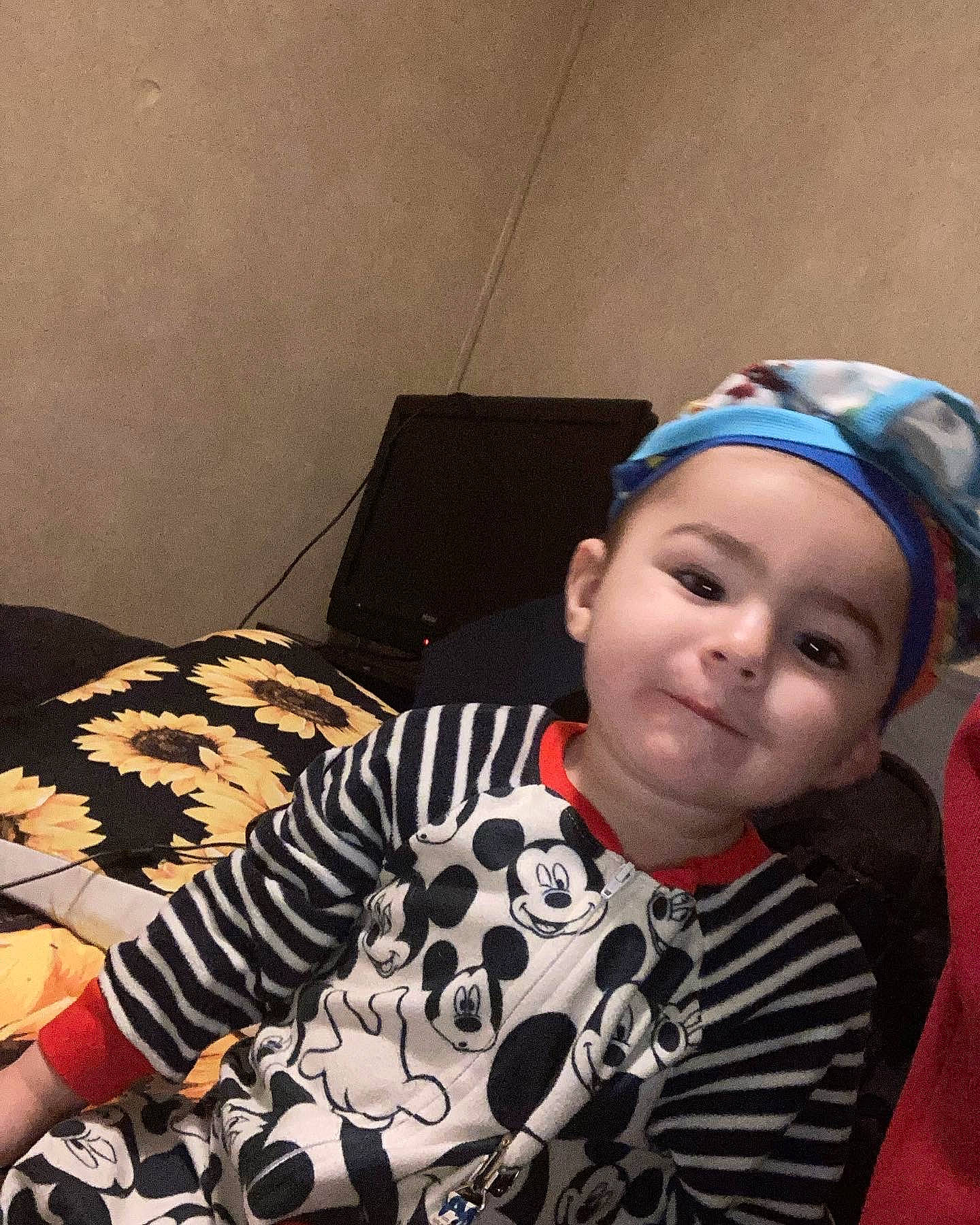 Chase is registered to the contest to win money with this photo: audio_equipment, comfort, cool, electronic_device, eyewear, flooring, forehead, fun, gadget, hairstyle, happy, headwear, pattern, person, personal_protective_equipment, room, selfie, sitting, sleeve, smile