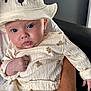 baby, infant, hat, bear, clothing, cute, face, person, hand, adult, skin, blue_eyes, sitting, holding, indoor, portrait, expression, soft_texture, white, cozy