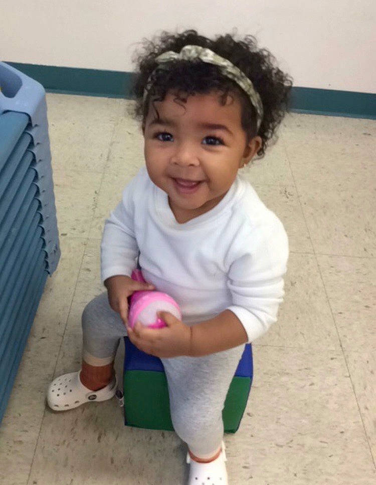 Maylani is registered to the contest to win money with this photo: baby, baby_toddler_clothing, cheek, clothing, face, happy, iris, joy, knee, leg, nose, person, pink, shorts, shoulder, skin, sleeve, smile, sneakers, standing