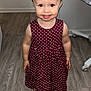 Realynn joined the competition — help win amazing prizes! toddler, child, smiling, dress, polka_dot, maroon, floor, wooden_floor, standing, indoors, young_child, happy, face, person, footwear, sandals, small_hands, cute, portrait, expression