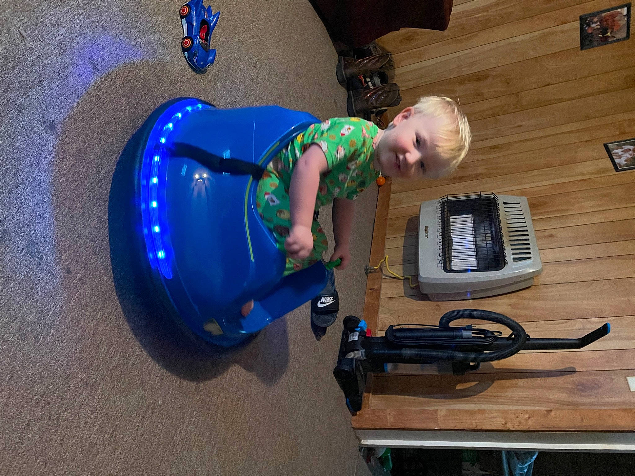 Sam is registered to the contest to win money with this photo: auto_part, automotive_exterior, automotive_tire, baby, bumper, cable, electric_blue, electrical_wiring, engineering, flooring, fun, gas, hardwood, machine, motor_vehicle, person, t_shirt, tire, toddler, wire