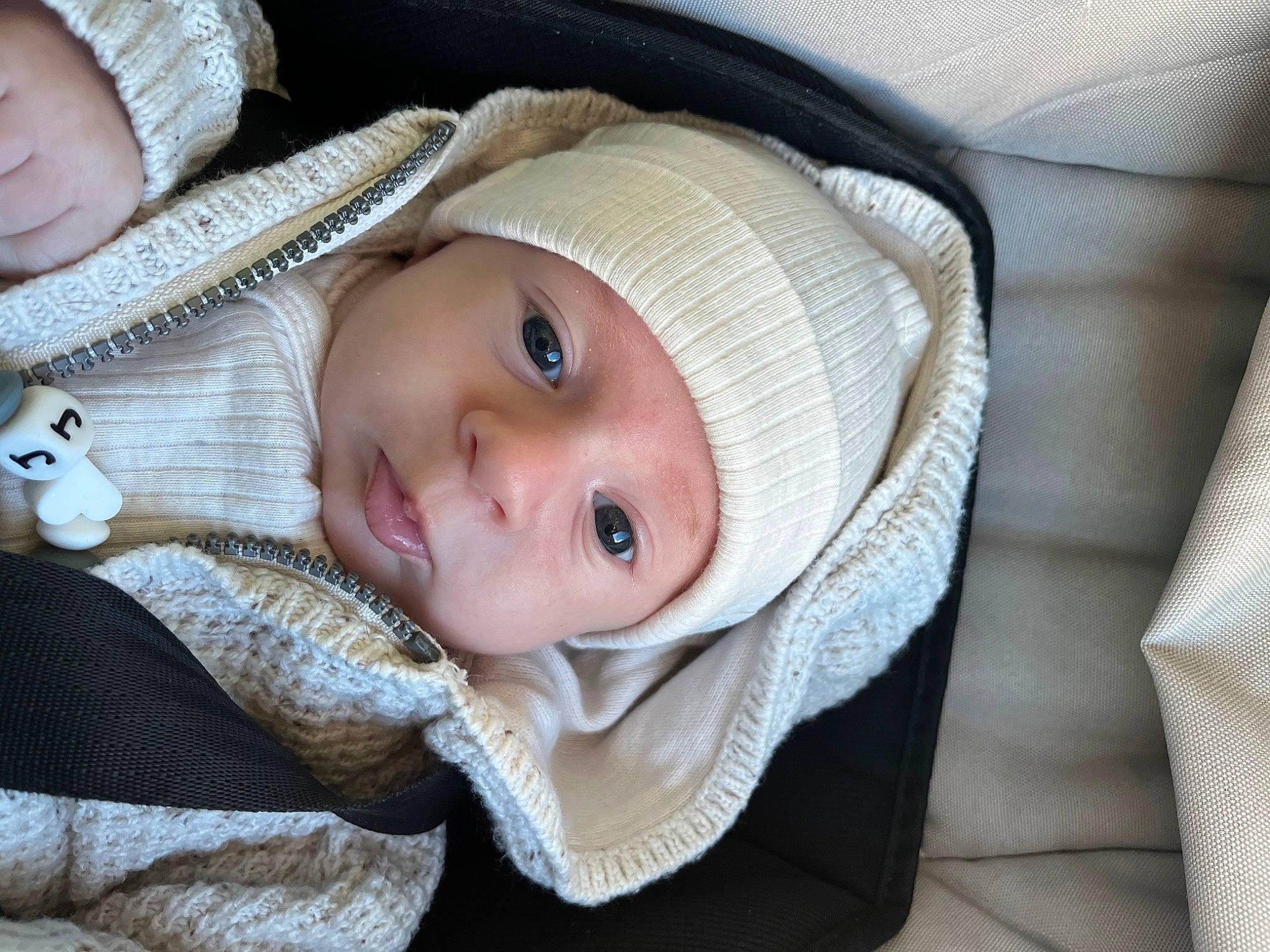 Joys participe au concours pour gagner de l'argent avec cette photo : baby, baby_carriage, baby_toddler_clothing, cap, cheek, child, comfort, eye, eyebrow, eyelash, face, head, headgear, headwear, iris, lip, nose, person, product, skin