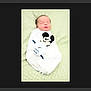 Haroun participe au concours pour gagner de l'argent avec cette photo : baby, newborn, infant, swaddled, blanket, sleeping, mickey_mouse_toy, plush_toy, soft_texture, portrait, centered, minimal_background, pale_green, white_wrap, peaceful, head, closed_eyes, top_view, cute, newborn_photography