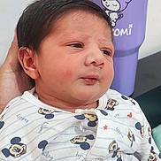 Mir Ihab joined the competition — help win amazing prizes! baby, child, infant, mickey_mouse, onesie, clothing, face, hair, hand, person, purple_tumbler, cartoon_character, background, indoor, portrait, cute, newborn, sleepy, soft_lighting, human