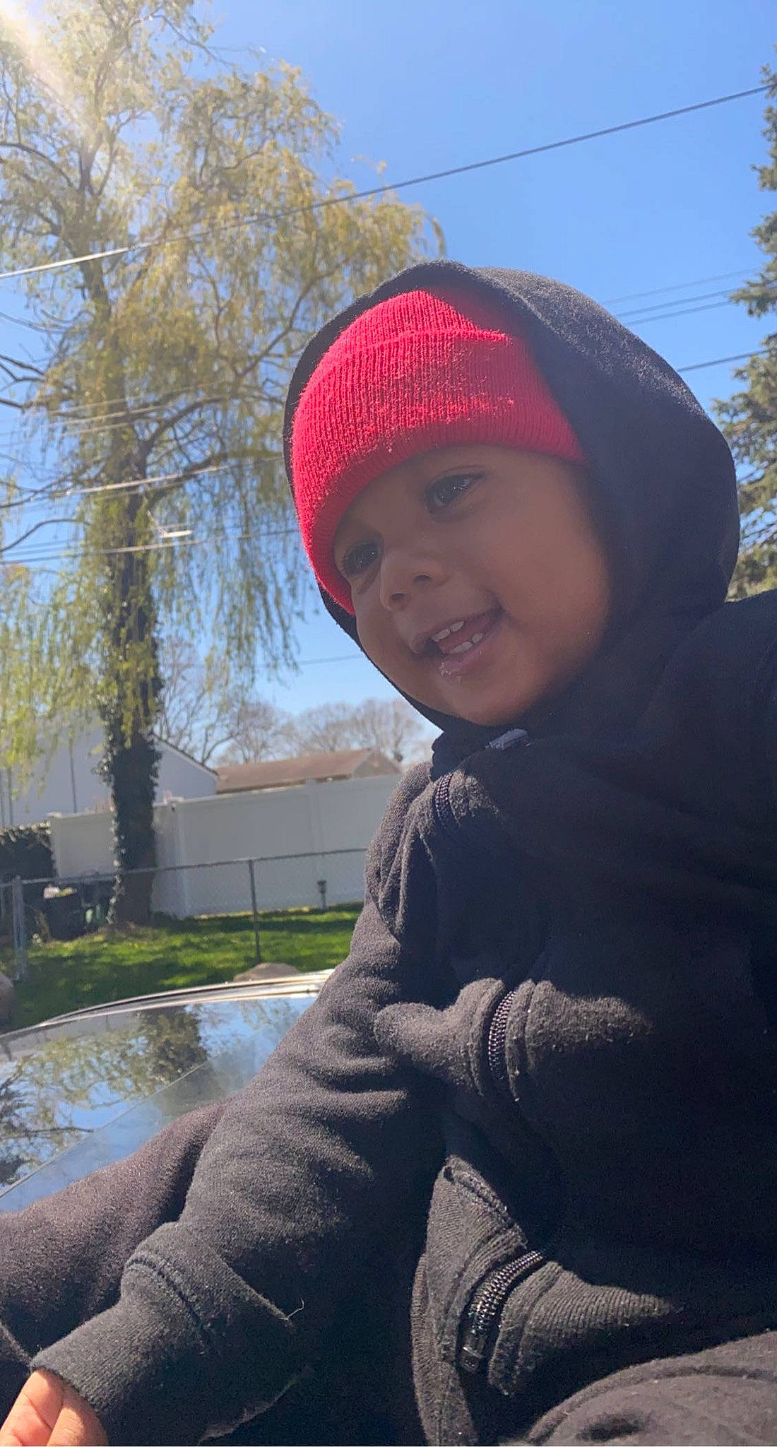 Kenzo is registered to the contest to win money with this photo: cap, cool, electric_blue, eye, freezing, grass, happy, headwear, human_body, jacket, knit_cap, lip, mammal, person, plant, public_space, sky, smile, sunlight, tints_and_shades