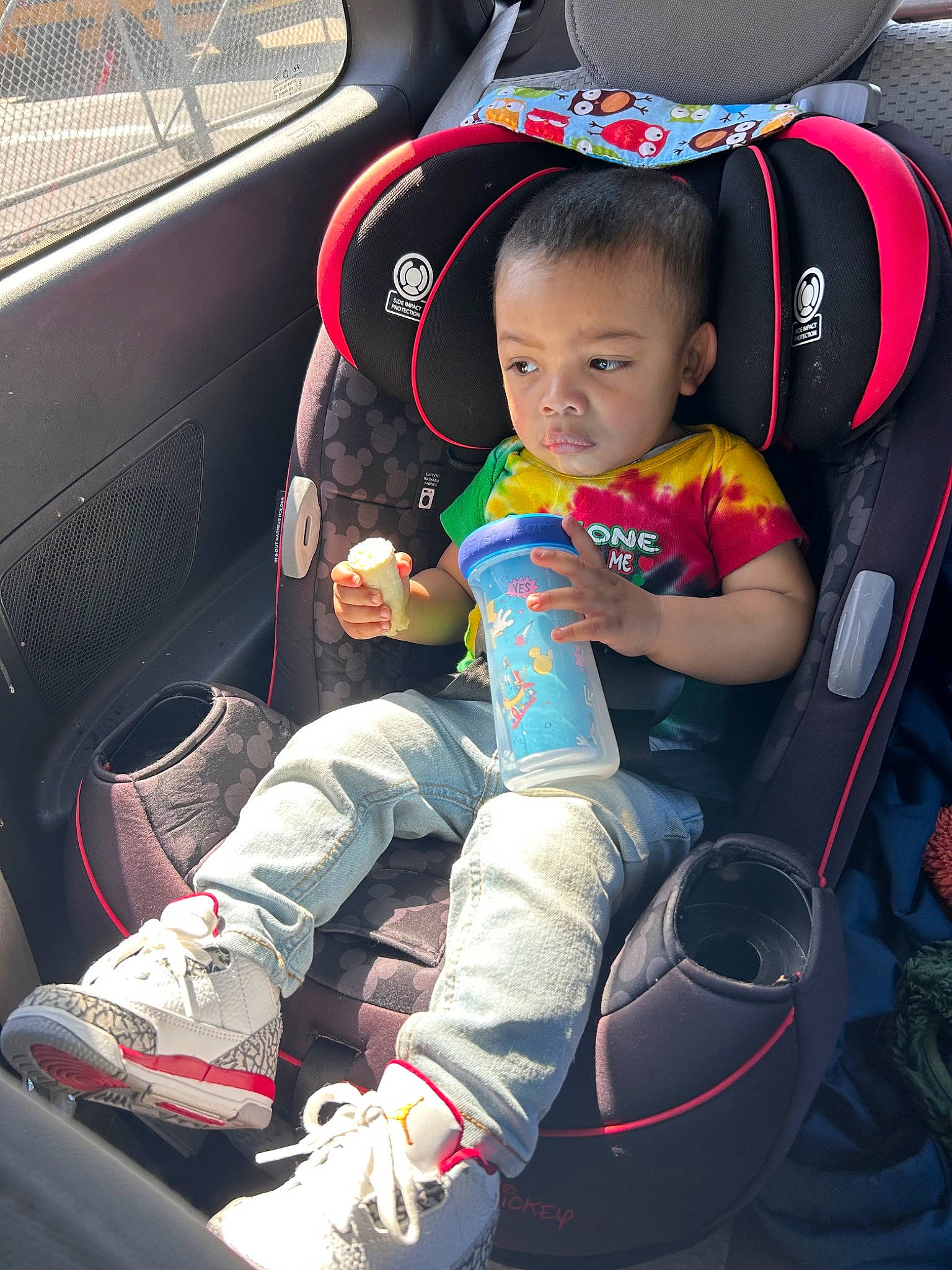 Keanu joined the competition — help win amazing prizes! auto_part, automotive_design, automotive_exterior, baby_carriage, baby_in_car_seat, baby_toddler_clothing, car, car_seat, car_seat_cover, comfort, family_car, fun, lap, motor_vehicle, person, sitting, sneakers, steering_wheel, toddler, vehicle