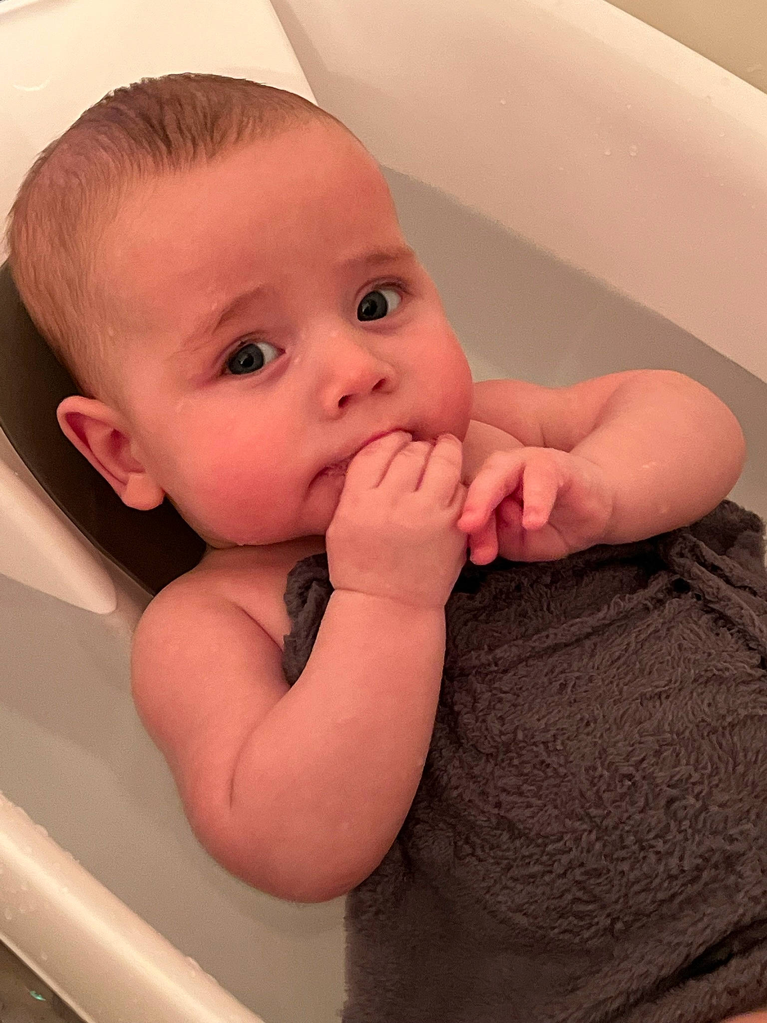 Camden is registered to the contest to win money with this photo: arm, baby, baby_toddler_clothing, cheek, chin, ear, eye, eyebrow, eyelash, finger, gesture, hand, iris, lip, mouth, neck, nose, person, shoulder, skin